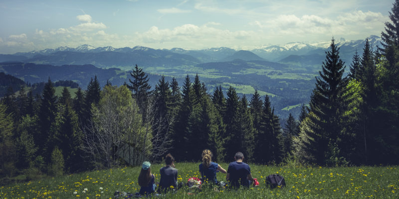 Family overlooking Colorado mountains — relocation services